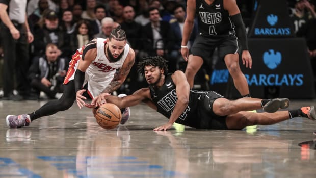 Miami Heat forward Caleb Martin (16) and Brooklyn Nets guard Cam Thomas (24) 